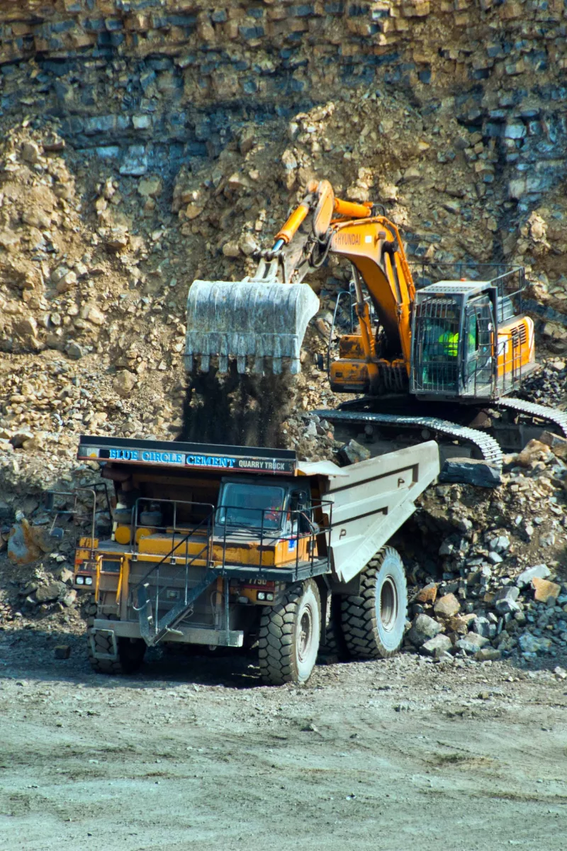 Excavator loading a quarry haul truck